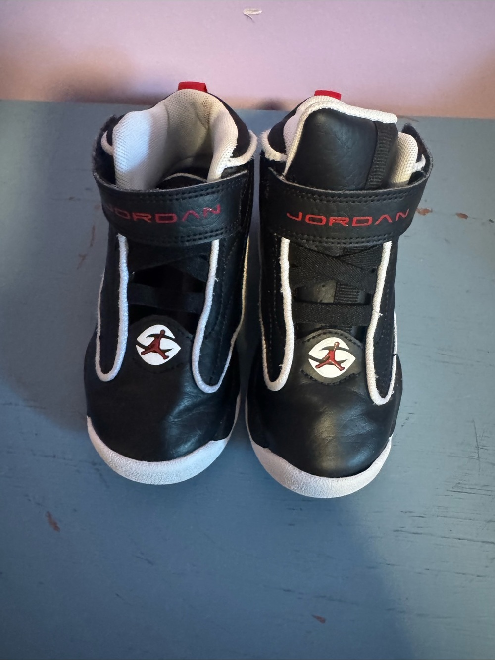 Jordan Kids Black and White High-Top Sneakers with Red Accents